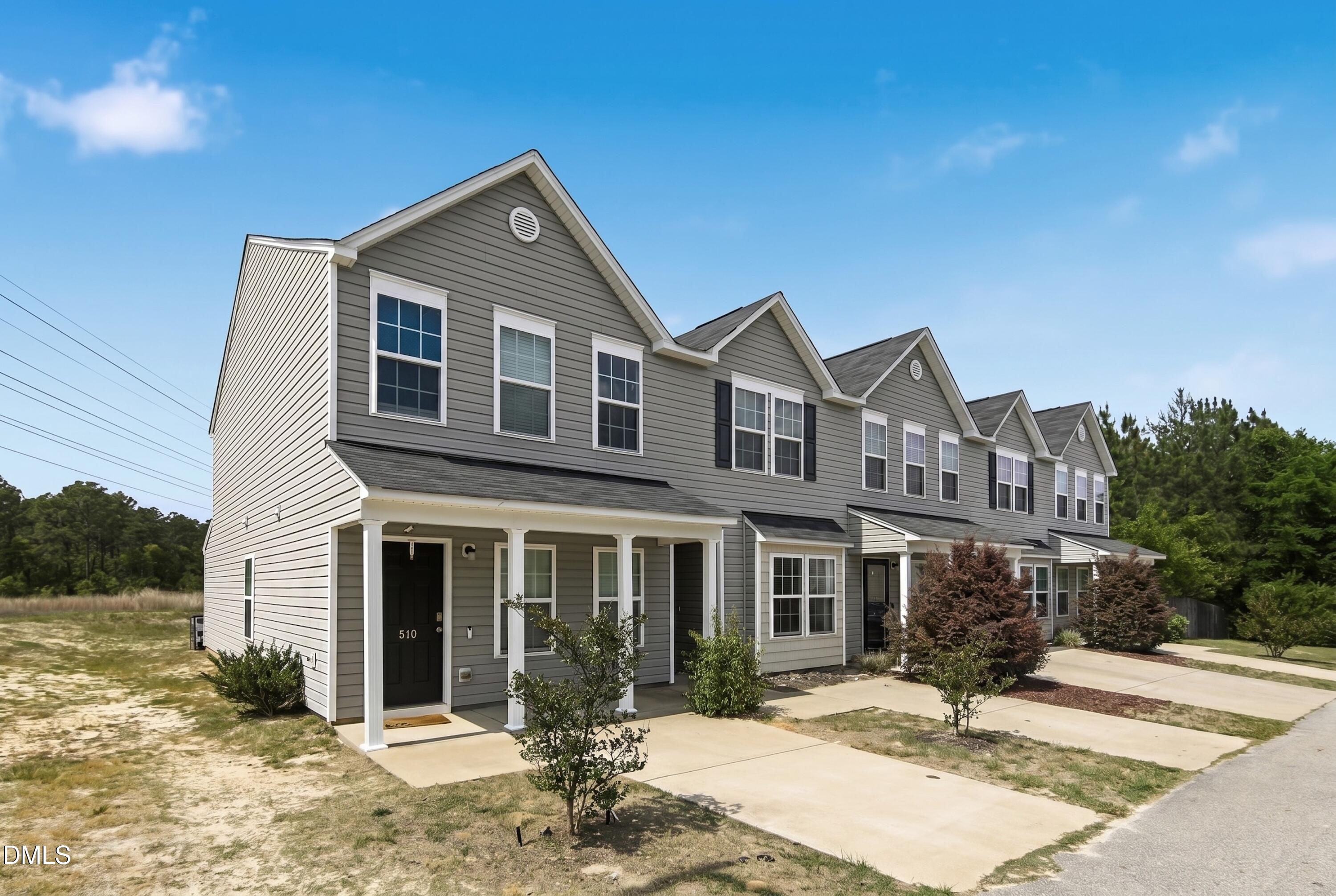 508 Directive Drive Hope Mills, NC 28348 - Photo 2 of 17 a front view of a house with a yard