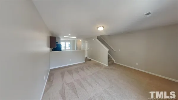 a view of an empty room and window