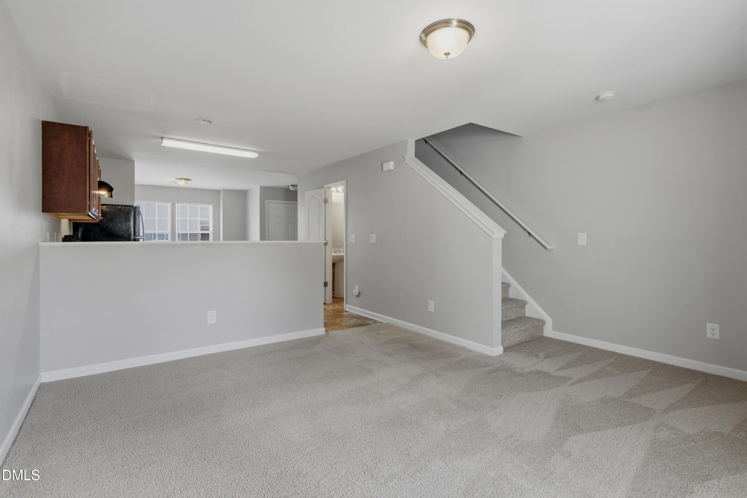 508 Directive Drive Hope Mills, NC 28348 - Photo 8 of 17 an empty room with windows and pillars in it