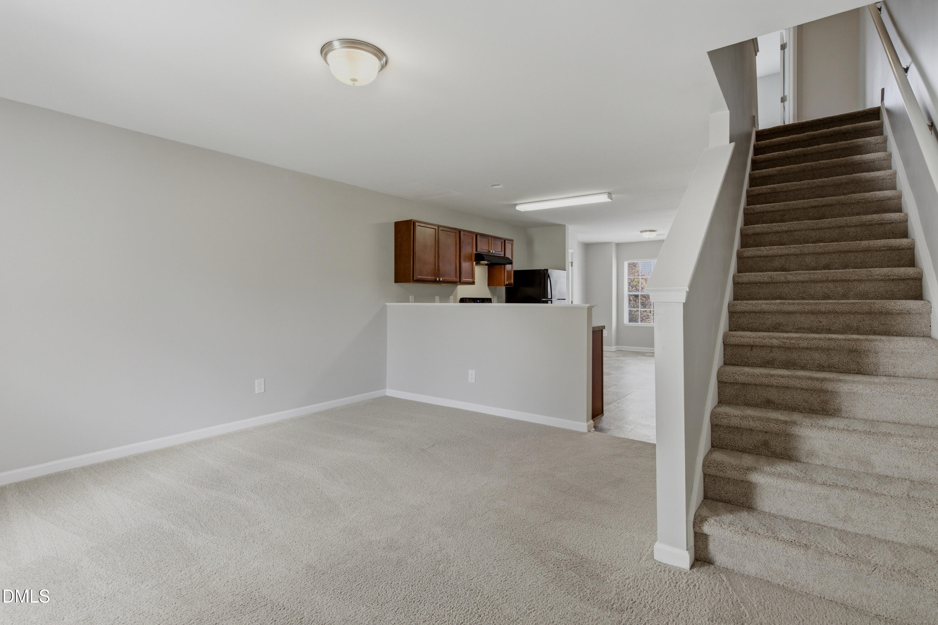 508 Directive Drive Hope Mills, NC 28348 - Photo 9 of 17 a view of a livingroom with wooden floor and stairs