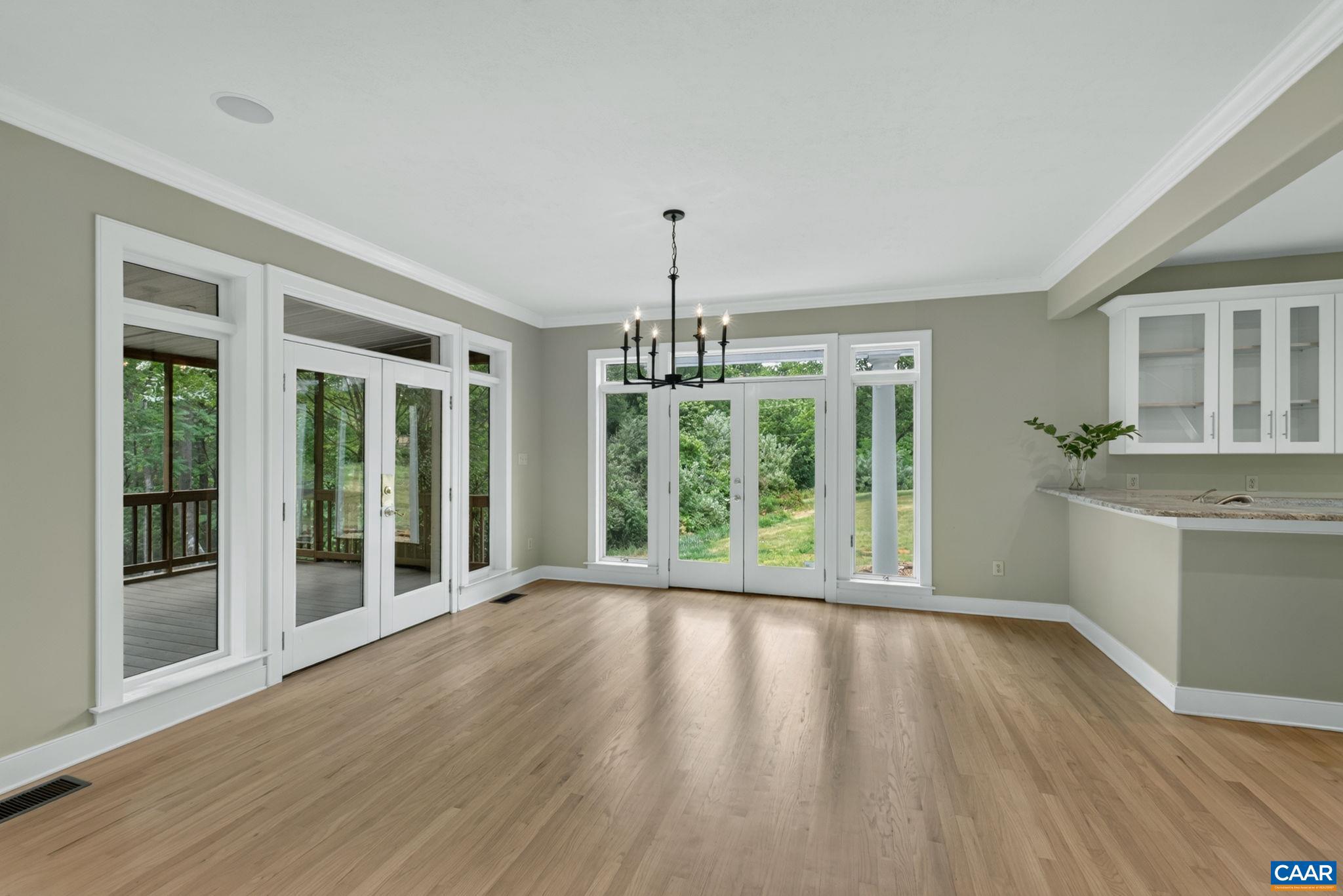 6285 Jarmans Gap Road Crozet, VA 22932 - Photo 7 of 65 a view of a room with wooden floor kitchen view and windows