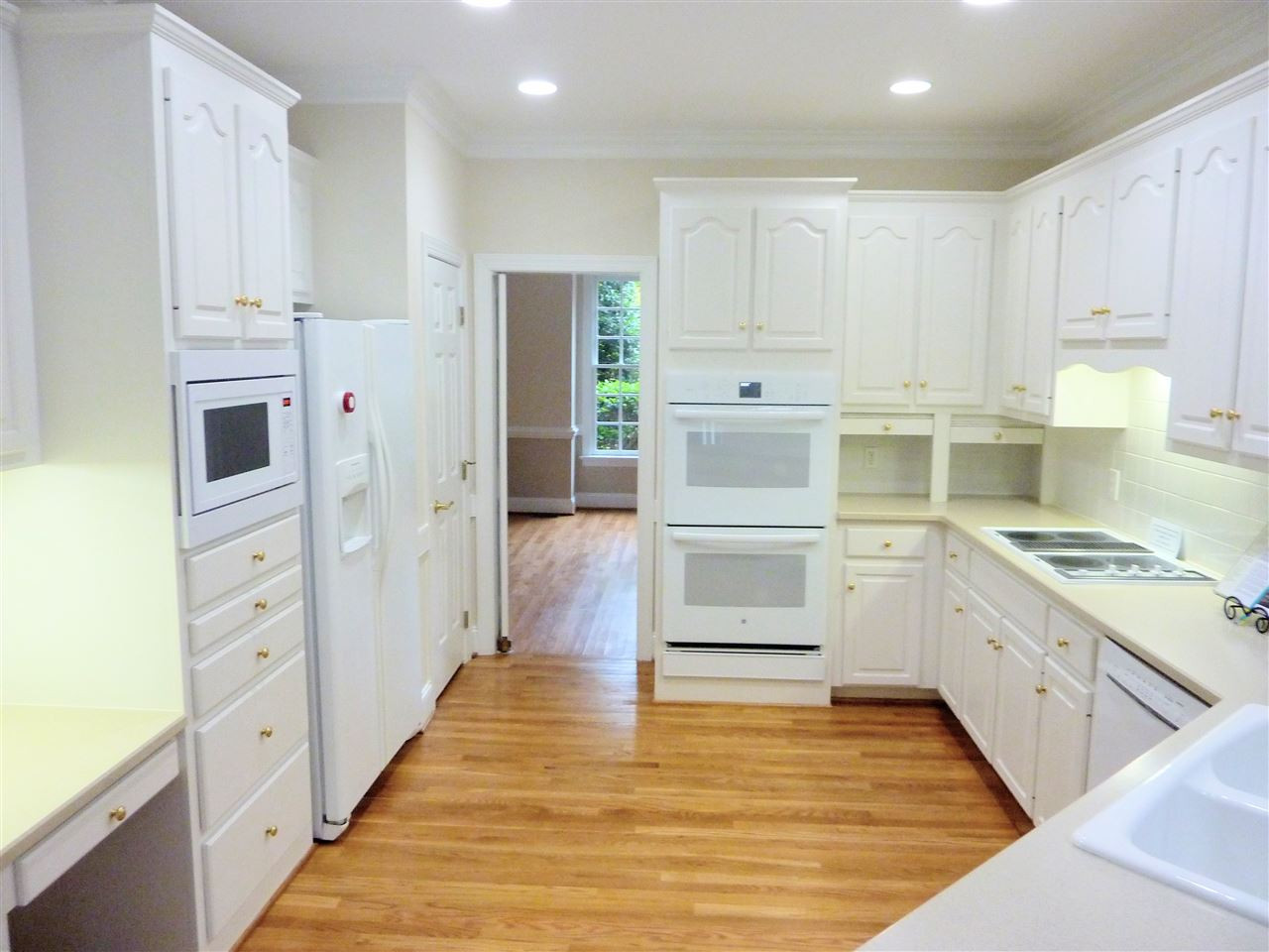 8708 Bell Grove Way Raleigh, NC 27615 - Photo 14 of 25 New GE Profile double ovens. Downndraft cooktop converts to griddle or grill. Kitchen without island