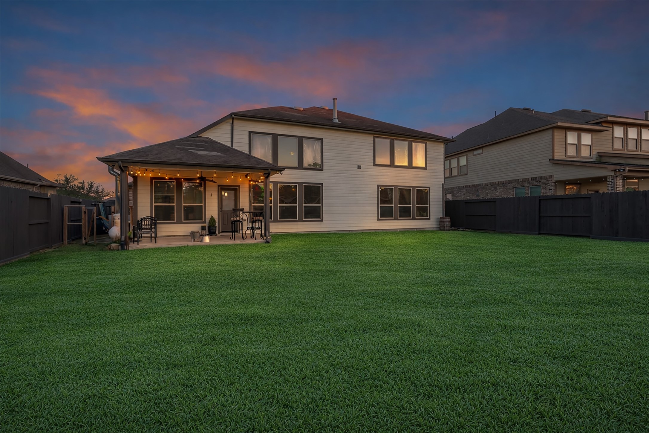 12602 Spellbrook Point Lane Tomball, TX 77377 - Photo 12 of 47 a front view of a house with a yard table and chairs