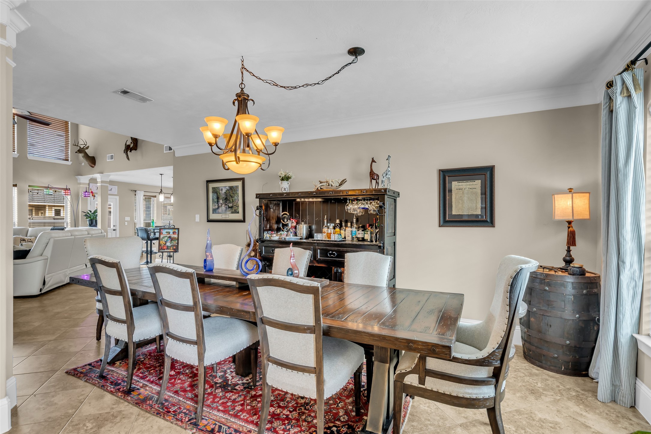 12602 Spellbrook Point Lane Tomball, TX 77377 - Photo 20 of 47 a dining room with wooden floor a chandelier a wooden table and chairs