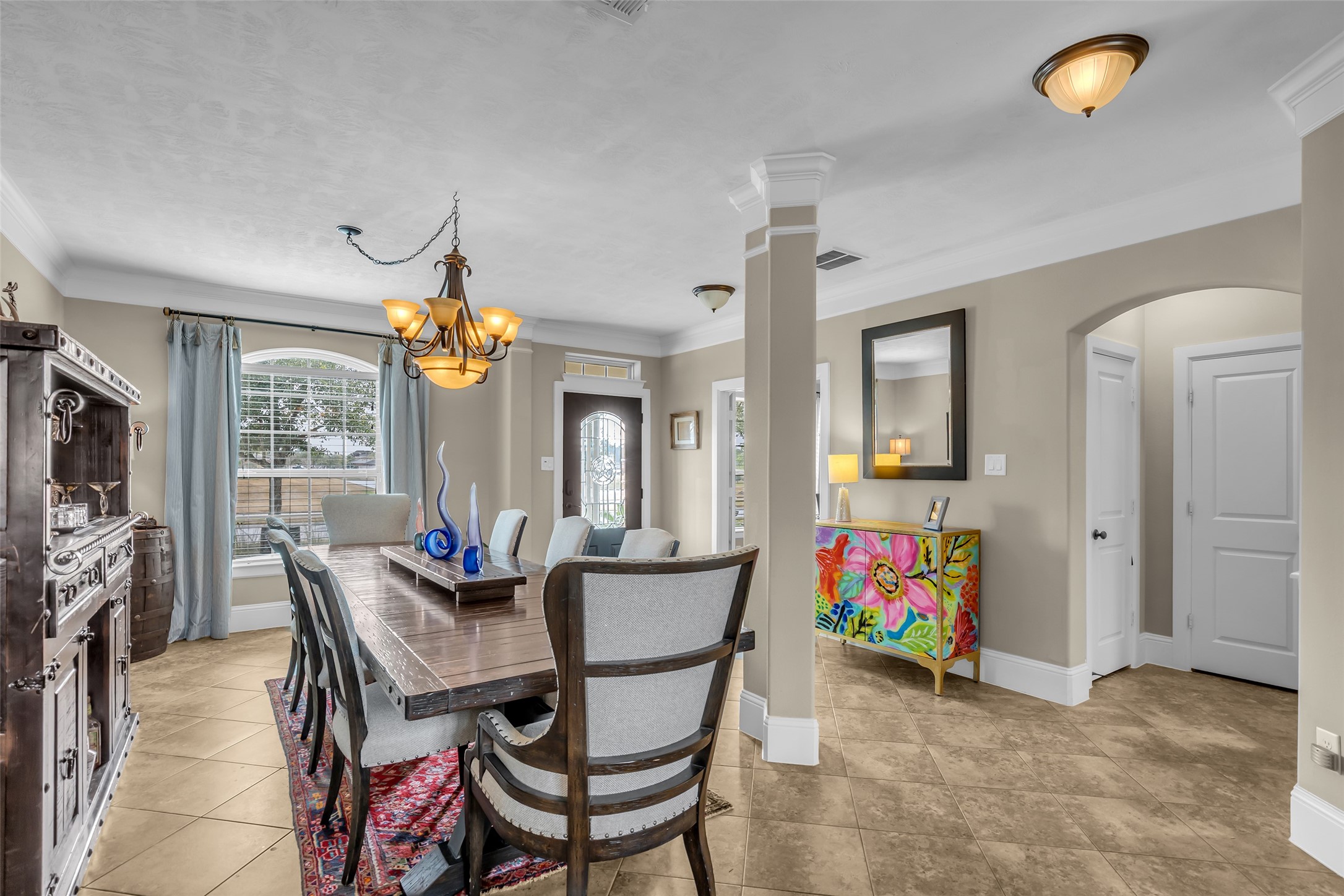 12602 Spellbrook Point Lane Tomball, TX 77377 - Photo 21 of 47 a dining room with furniture and a floor to ceiling window