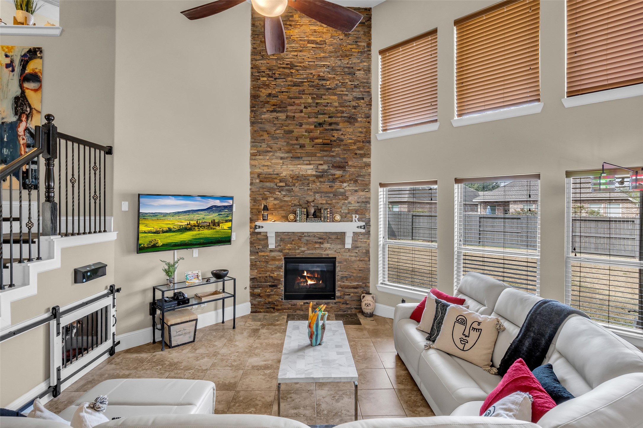 12602 Spellbrook Point Lane Tomball, TX 77377 - Photo 22 of 47 a living room with fireplace furniture and a flat screen tv