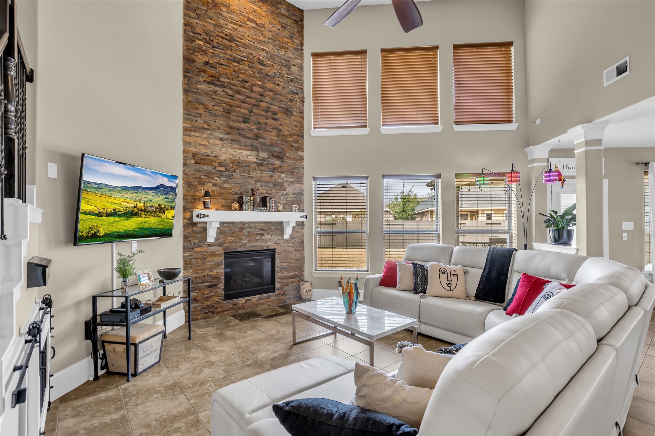 12602 Spellbrook Point Lane Tomball, TX 77377 - Photo 23 of 47 a living room with furniture a fireplace and a flat screen tv