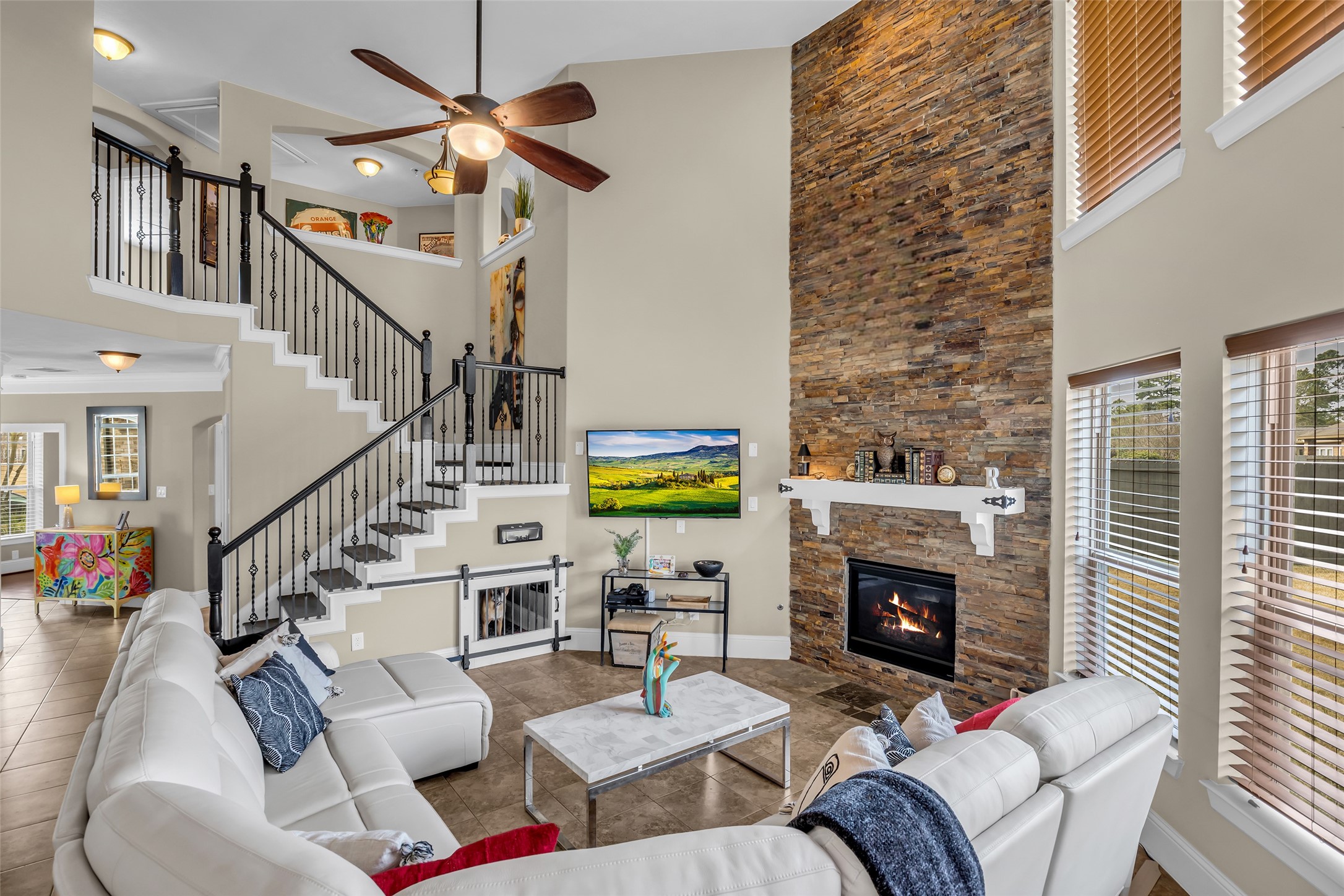 12602 Spellbrook Point Lane Tomball, TX 77377 - Photo 24 of 47 a living room with furniture a fireplace and a flat screen tv