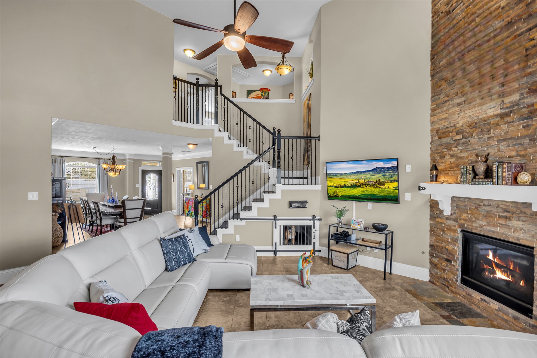 12602 Spellbrook Point Lane Tomball, TX 77377 - Photo 25 of 47 a living room with furniture and a fireplace