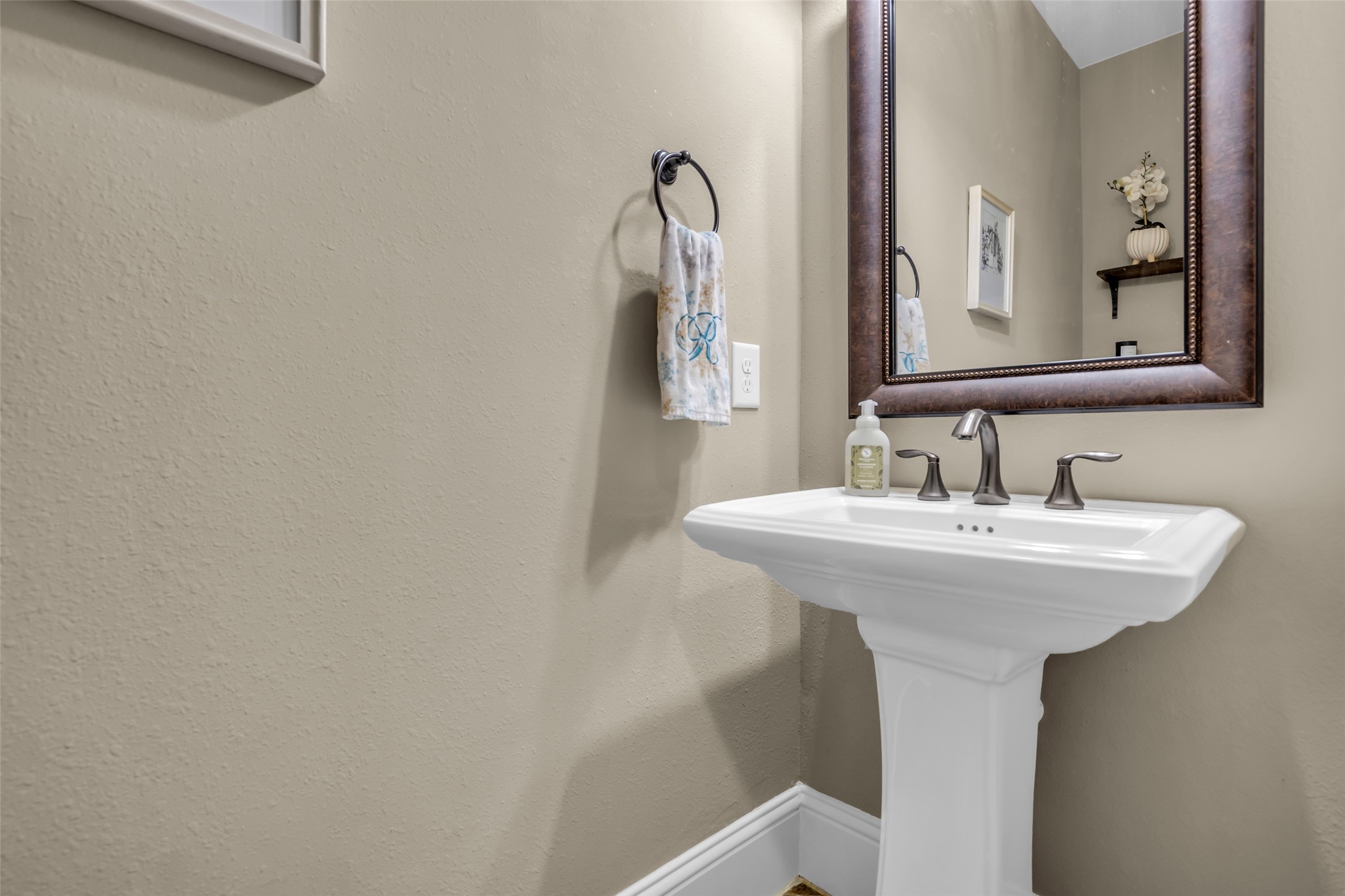 12602 Spellbrook Point Lane Tomball, TX 77377 - Photo 34 of 47 a bathroom with a sink and a mirror