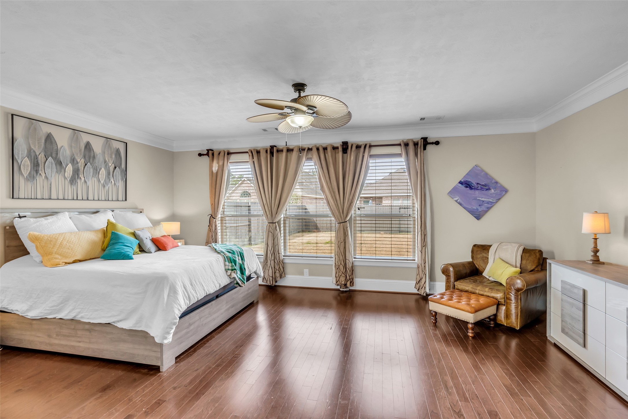 12602 Spellbrook Point Lane Tomball, TX 77377 - Photo 35 of 47 a bedroom with a bed and a chandelier