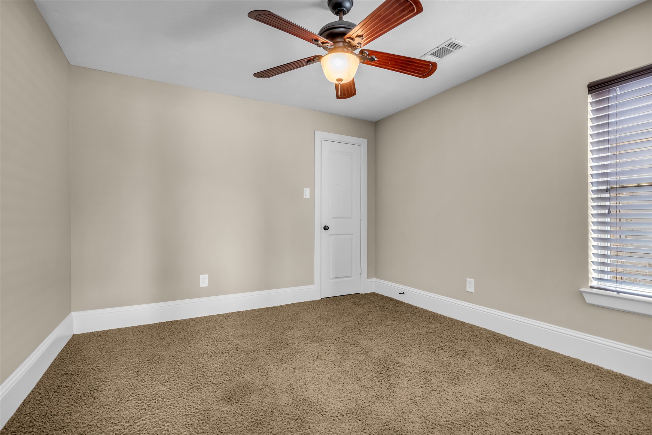 12602 Spellbrook Point Lane Tomball, TX 77377 - Photo 40 of 47 an empty room with windows and fan