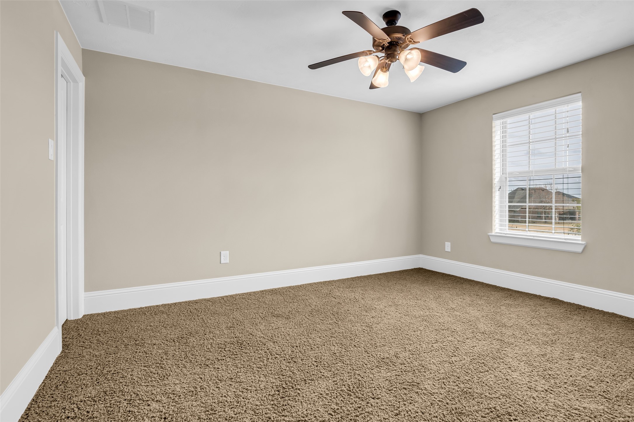 12602 Spellbrook Point Lane Tomball, TX 77377 - Photo 41 of 47 wooden floor in an empty room with a window