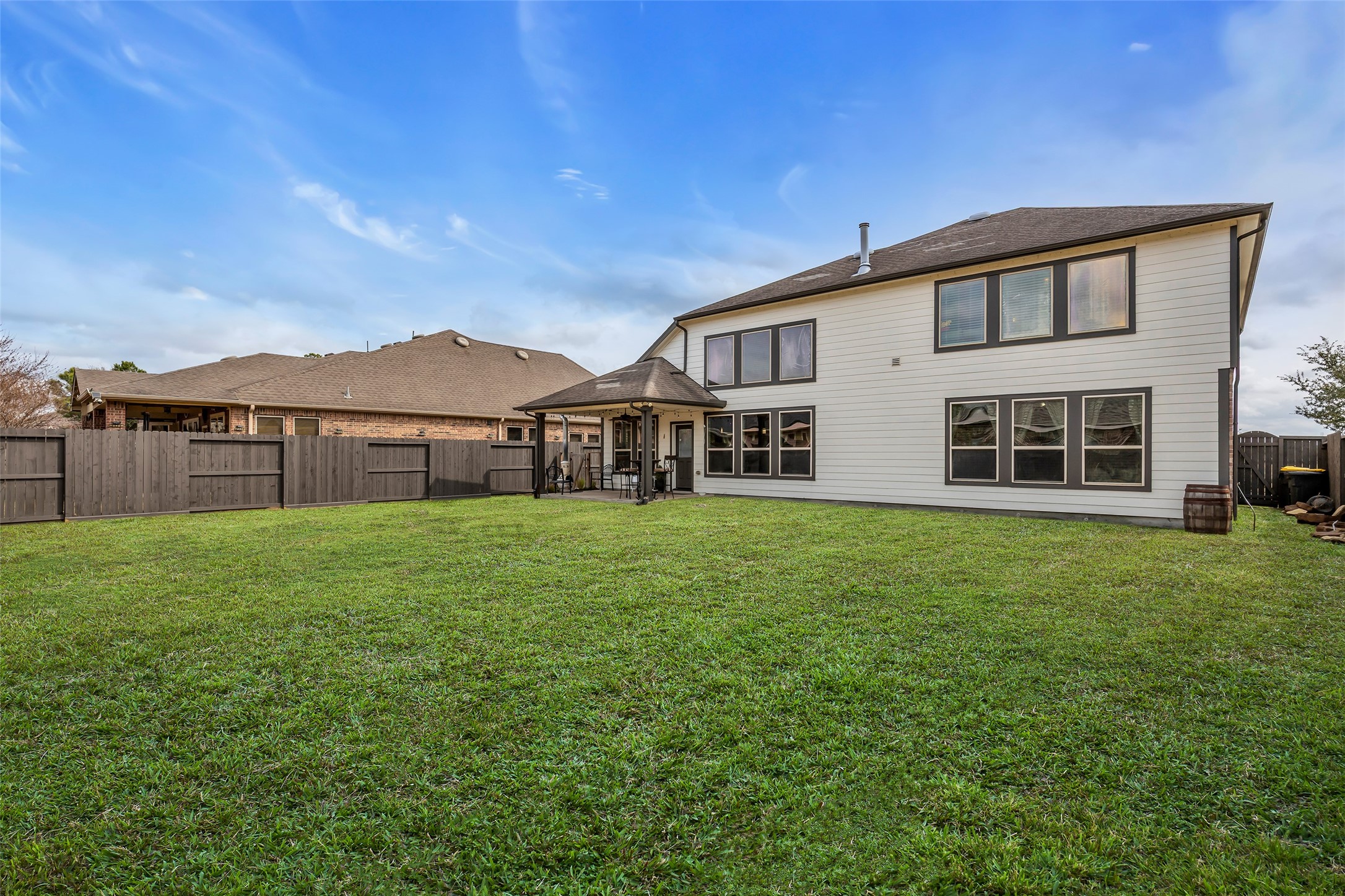 12602 Spellbrook Point Lane Tomball, TX 77377 - Photo 8 of 47 a view of a house with a big yard and large tree