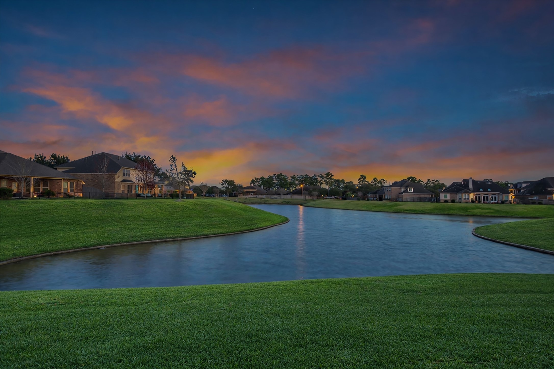 12602 Spellbrook Point Lane Tomball, TX 77377 - Photo 9 of 47 a view of a lake with houses in the background