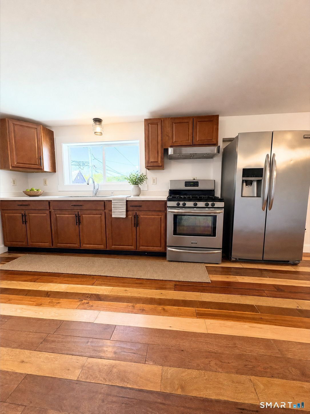 42 Pulver Street Torrington, CT 06790 - Photo 2 of 7 a view of kitchen with wooden cabinet and stainless steel appliances