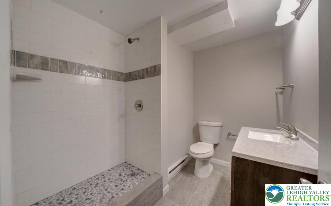 199 North Northgate Road Lake Ariel, PA 18436 - Photo 11 of 35 a bathroom with a sink a toilet and shower