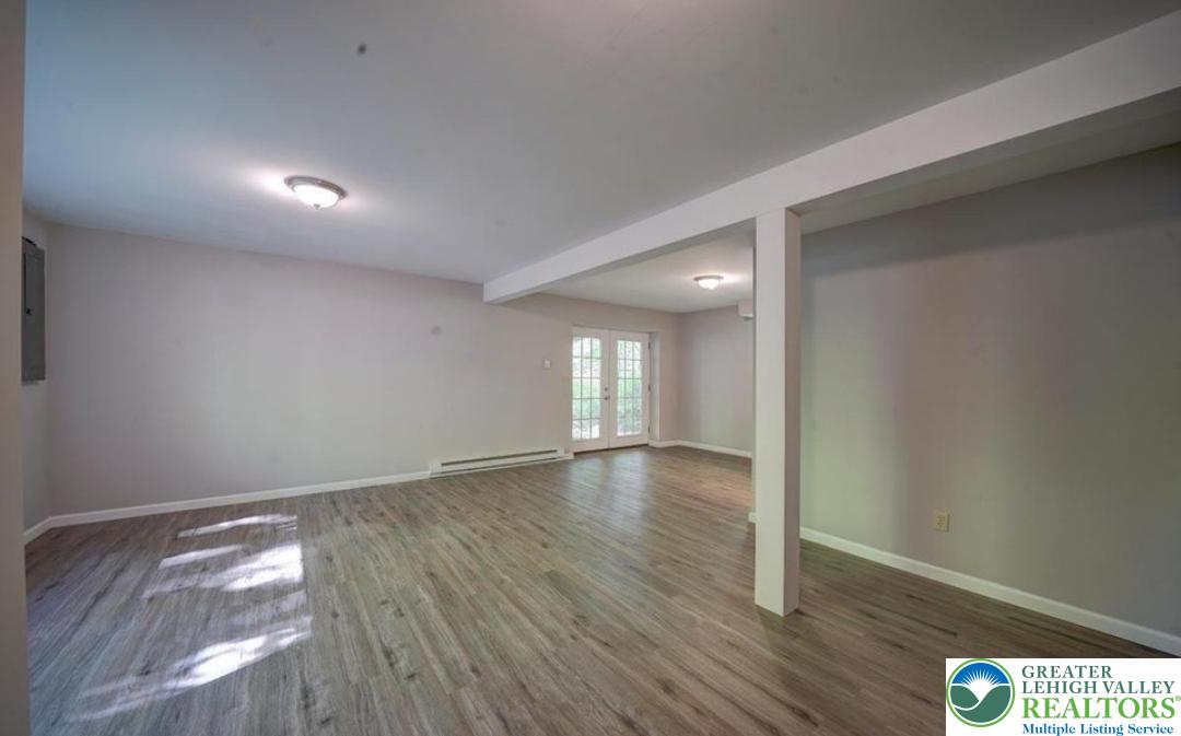 199 North Northgate Road Lake Ariel, PA 18436 - Photo 12 of 35 an empty room with wooden floor and windows