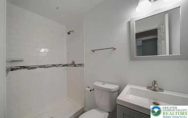 a bathroom with a sink and toilet