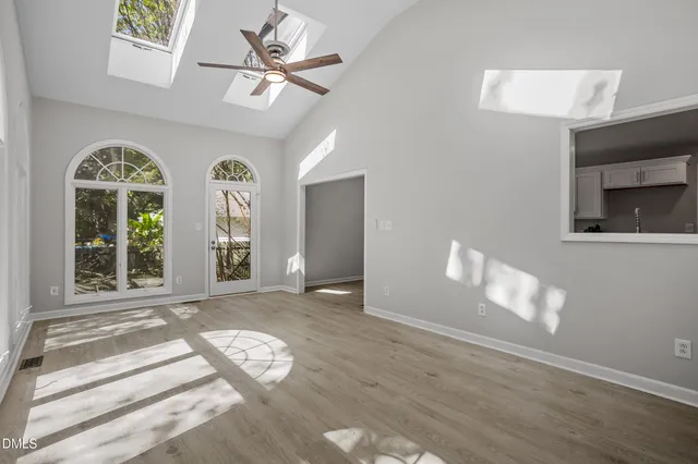 a view of an entryway with wooden floor