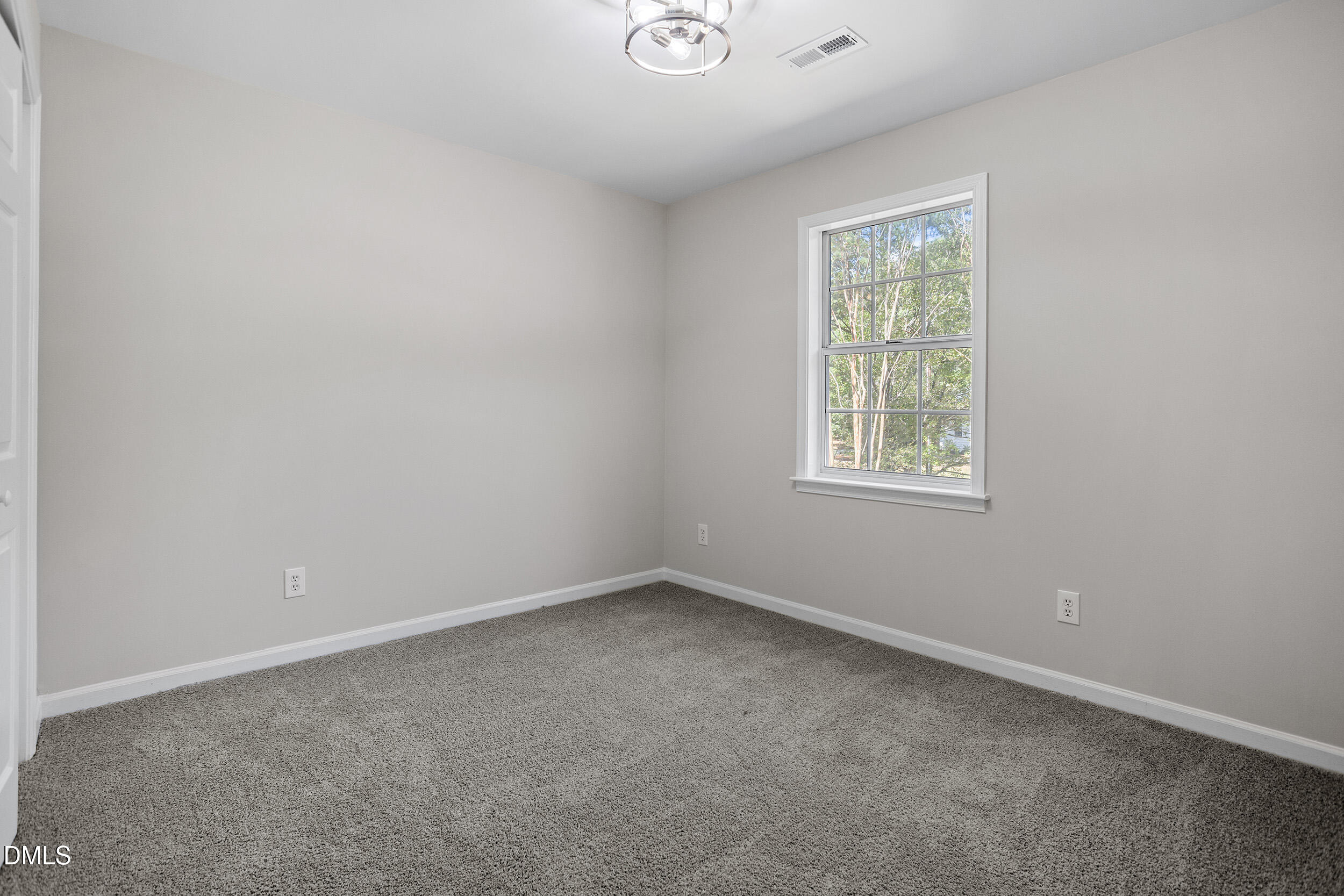 1103 Suterland Road Cary, NC 27511 - Photo 17 of 21 an empty room with a window