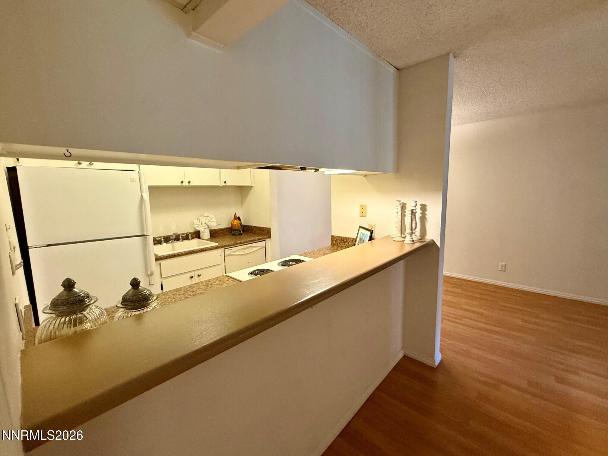 2955 Lakeside Drive, Unit 120 Reno, NV 89509 - Photo 11 of 21 a kitchen with counter top and deck