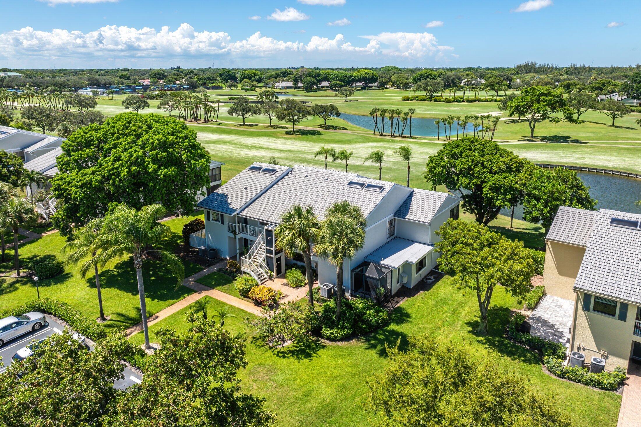 an aerial view of residential houses with outdoor space and street view