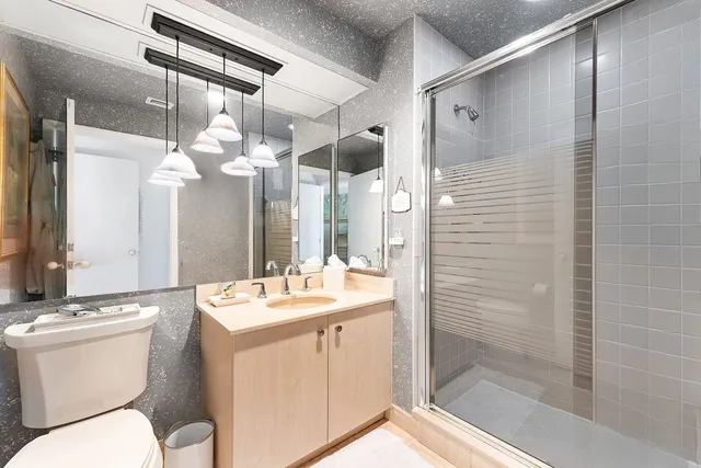 a view from deck with patio