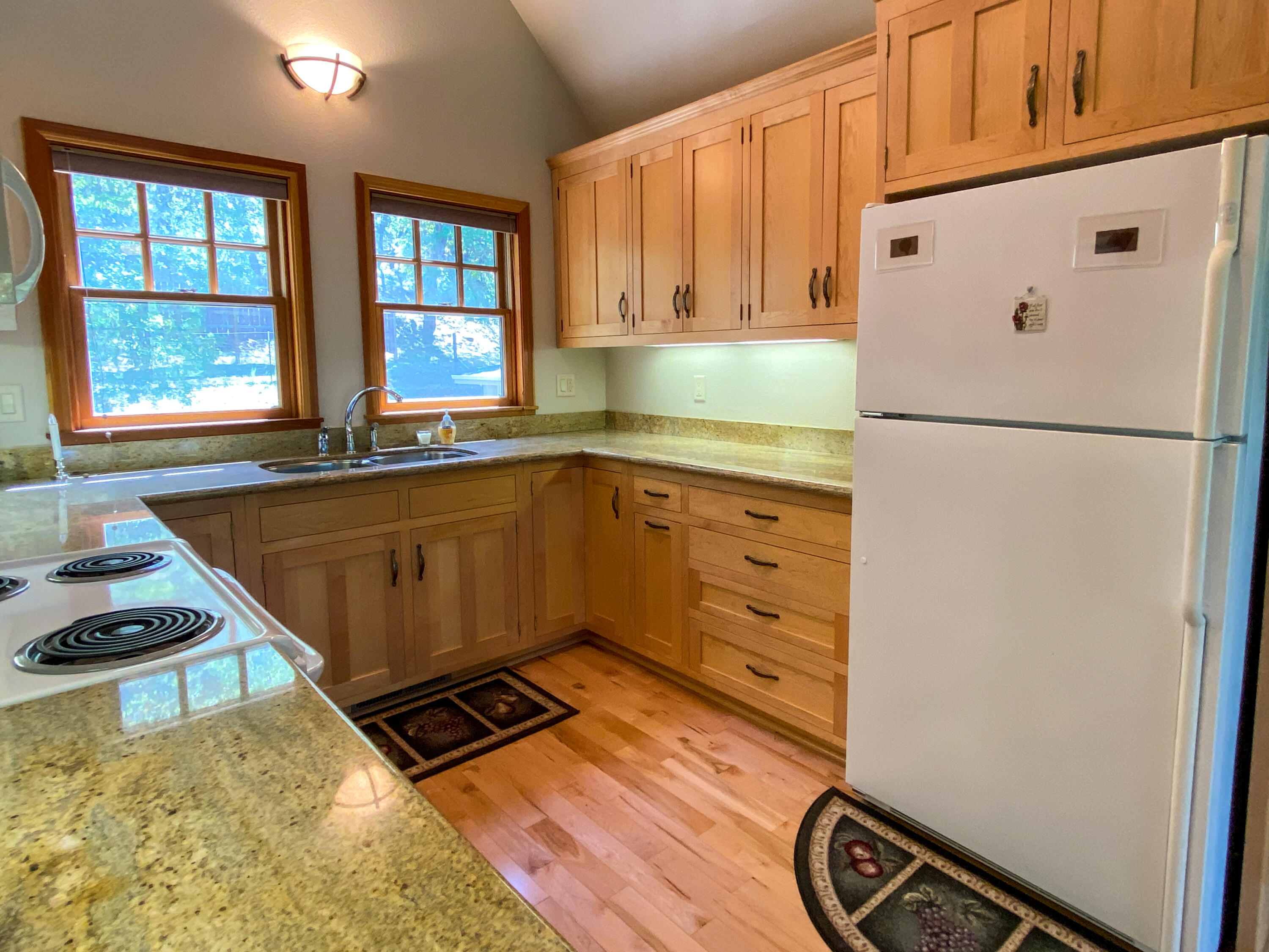 310 Goose Ranch Road Lewiston, CA 96052 - Photo 25 of 34 a white refrigerator freezer sitting inside of a kitchen