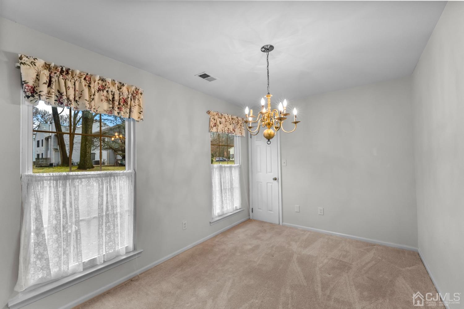 1801 Timber Oaks Road Edison, NJ 08820 - Photo 14 of 35 a view of a room that has a large window and front door