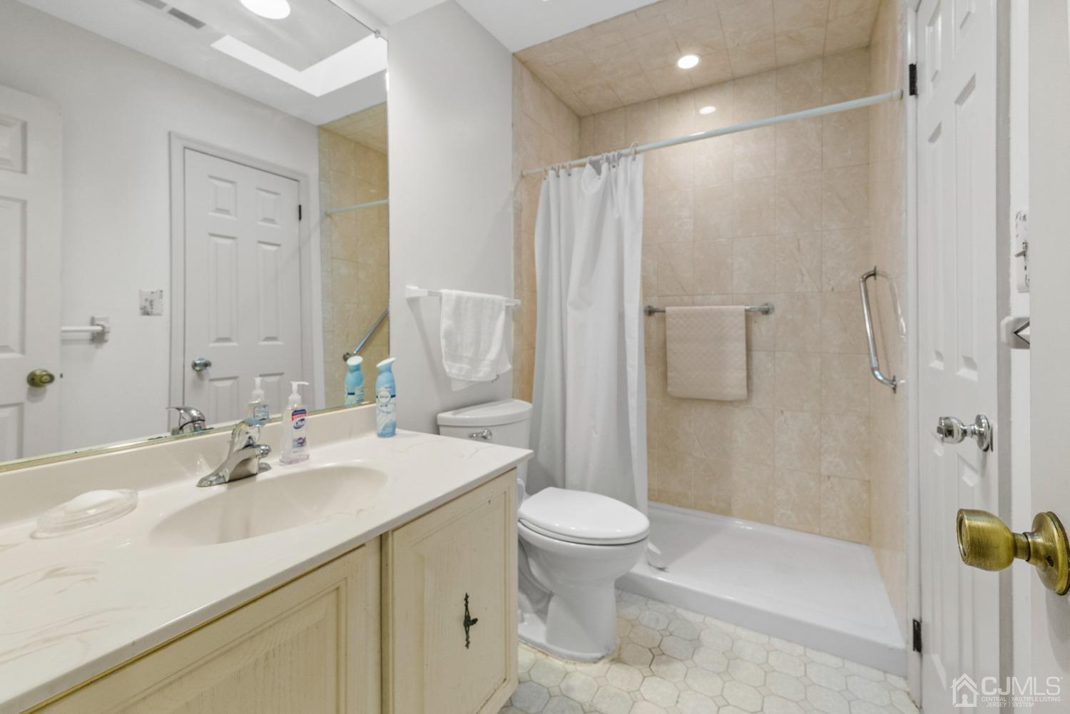 1801 Timber Oaks Road Edison, NJ 08820 - Photo 19 of 35 a bathroom with a sink toilet and shower