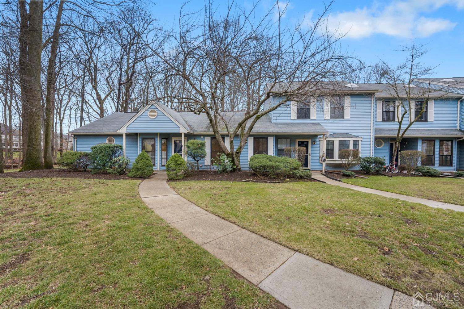 1801 Timber Oaks Road Edison, NJ 08820 - Photo 2 of 35 a front view of a building with a garden