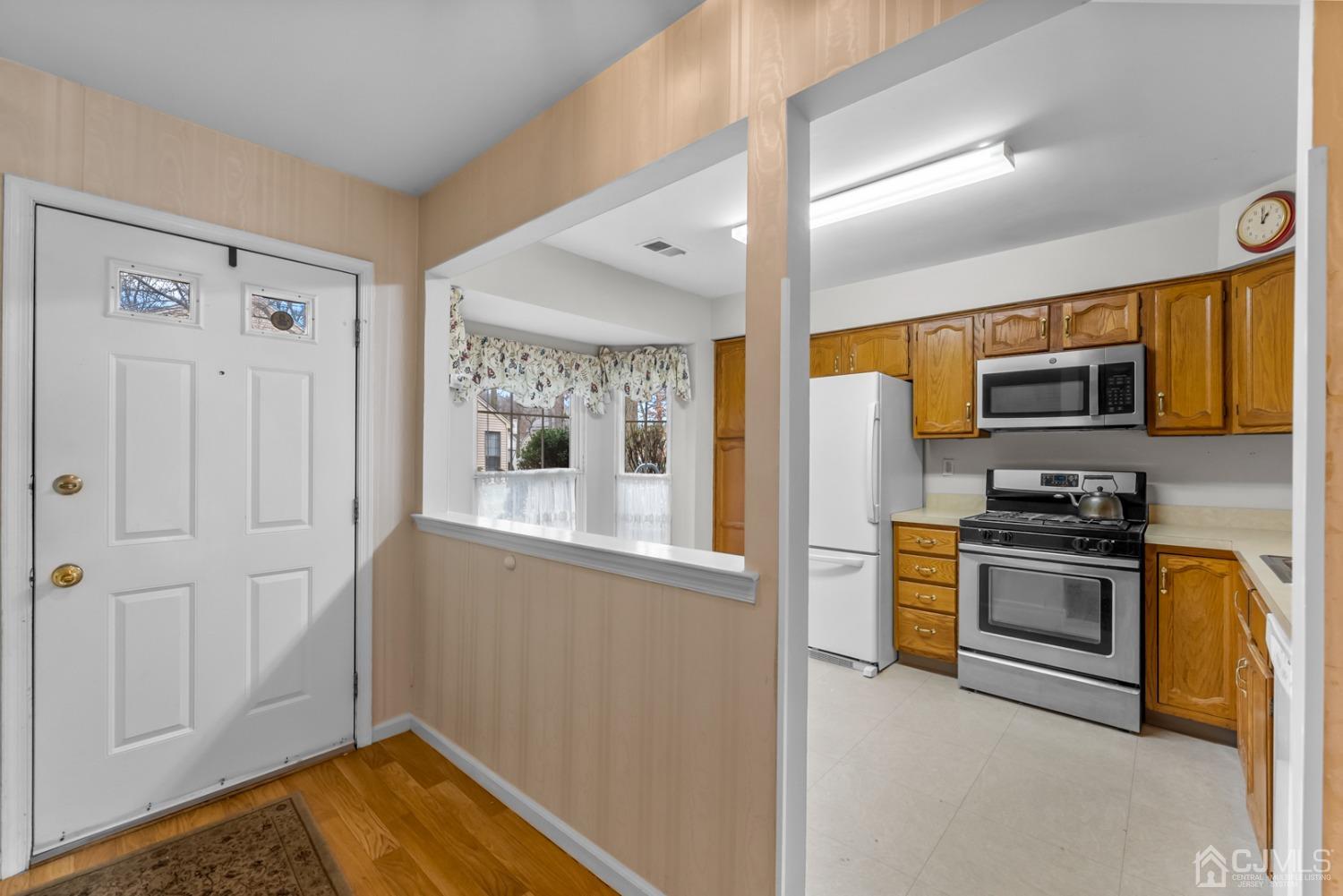 1801 Timber Oaks Road Edison, NJ 08820 - Photo 4 of 35 a kitchen with stainless steel appliances granite countertop a refrigerator and a stove top oven