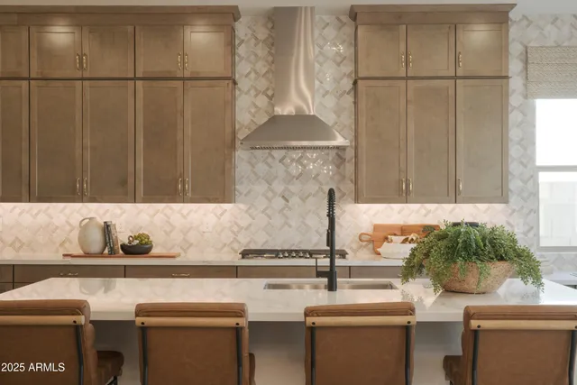 a living room with fireplace furniture and a large window