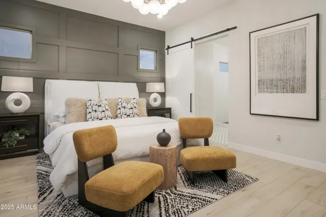 a living room with furniture and flowers