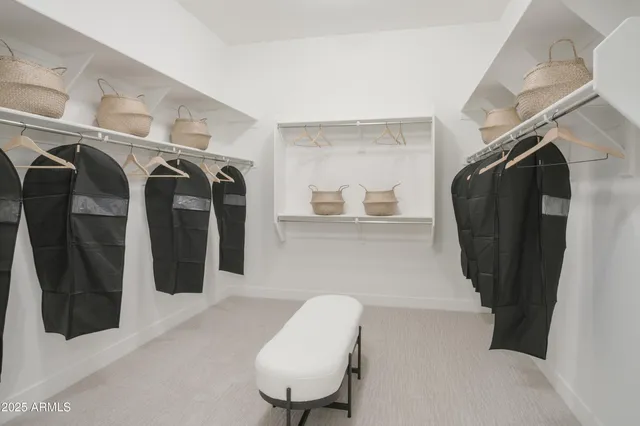 a living room with furniture a rug and a wall painting