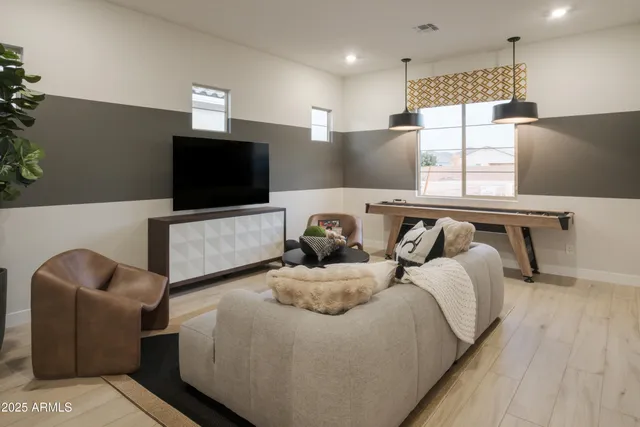 a view of a town with mountains in the background