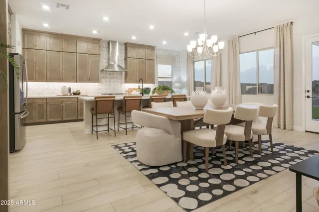 a kitchen with stainless steel appliances kitchen island granite countertop a sink and cabinets