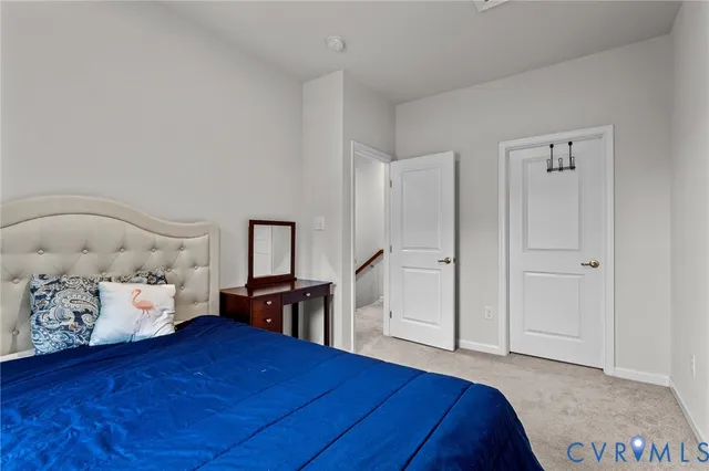 a bedroom with a bed and dresser