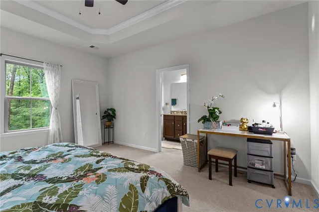 a bedroom that has a bed and a table in it