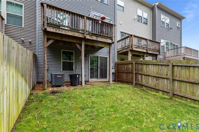 a view of backyard with deck and deck