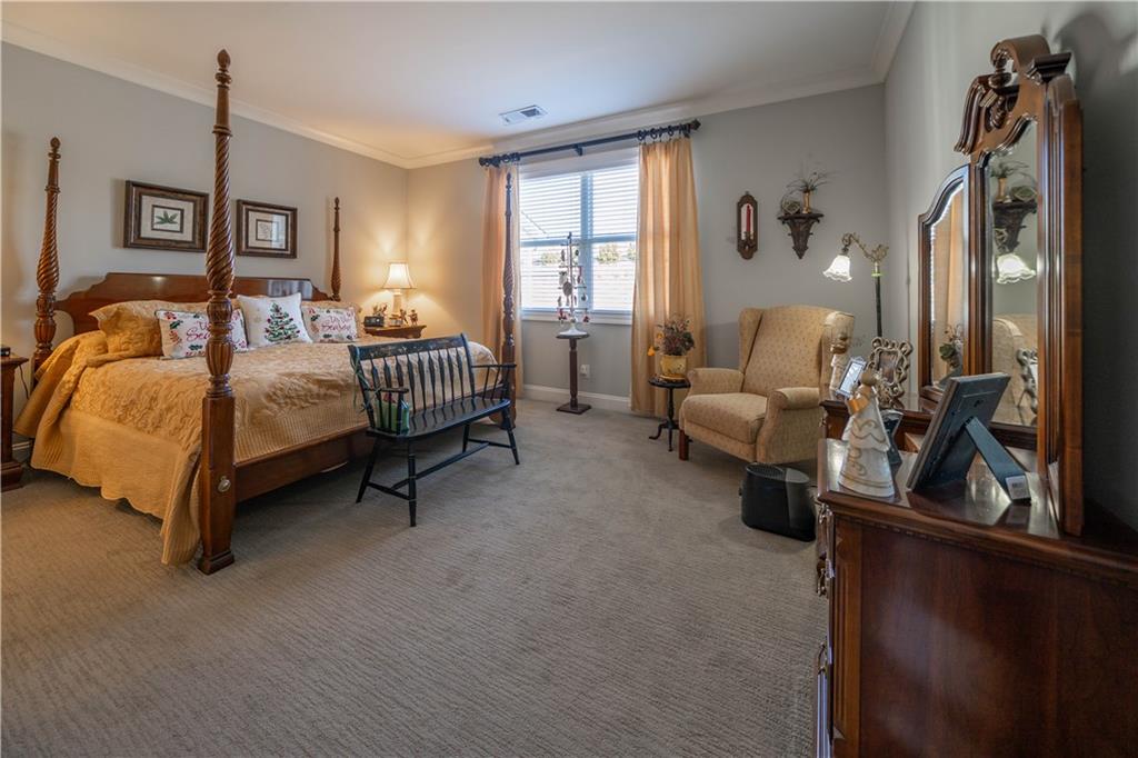 32 Encore Lane Cartersville, GA 30120 - Photo 13 of 28 a spacious bedroom with a bed and a couch