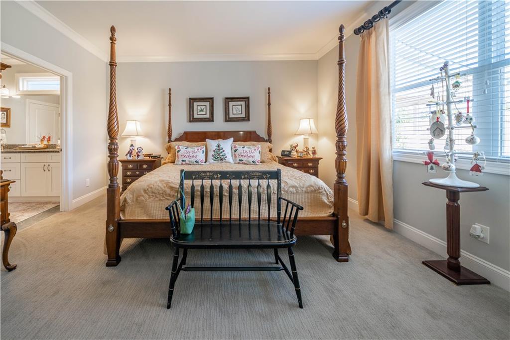 32 Encore Lane Cartersville, GA 30120 - Photo 14 of 28 a bedroom with a bed and a table