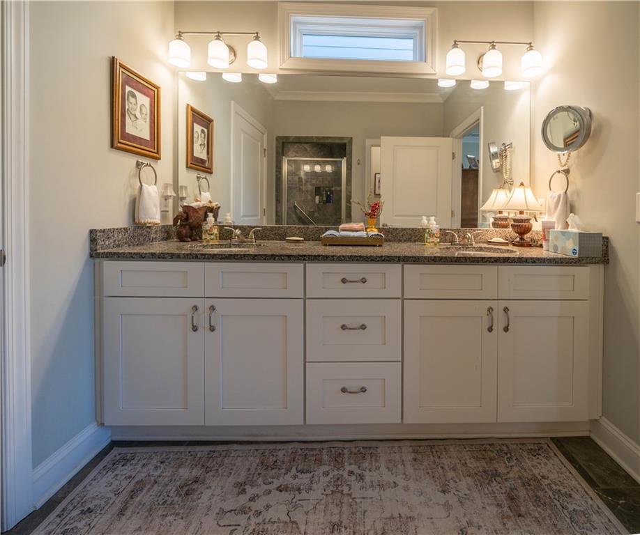 32 Encore Lane Cartersville, GA 30120 - Photo 16 of 28 a bathroom with a sink and a mirror