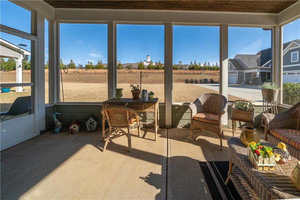 32 Encore Lane Cartersville, GA 30120 - Photo 26 of 28 a living room with furniture and floor to ceiling windows