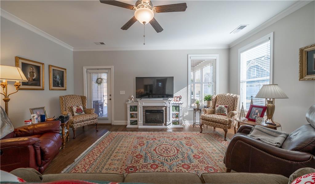 32 Encore Lane Cartersville, GA 30120 - Photo 4 of 28 a living room with furniture a flat screen tv and a fireplace