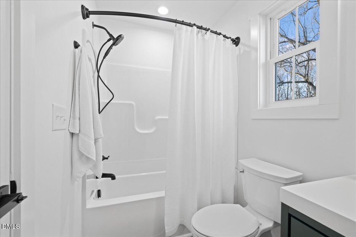 617 North 3rd Street Mebane, NC 27302 - Photo 37 of 50 a bathroom with a shower a toilet and a shower