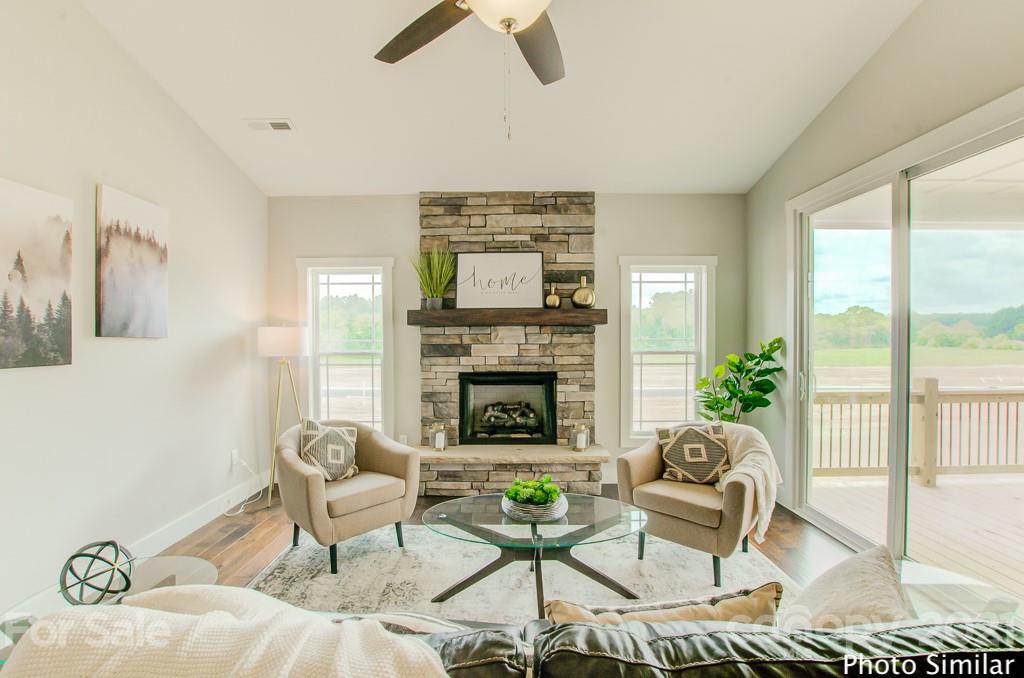 123 Hayes Rdg Lane, Unit 4 Mills River, NC 28759 - Photo 1 of 18 a living room with furniture and a fireplace