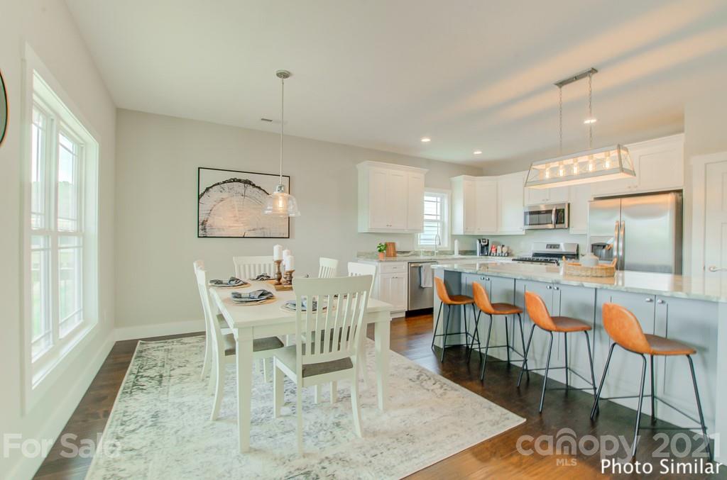 123 Hayes Rdg Lane, Unit 4 Mills River, NC 28759 - Photo 8 of 18 a view of a dining room with furniture