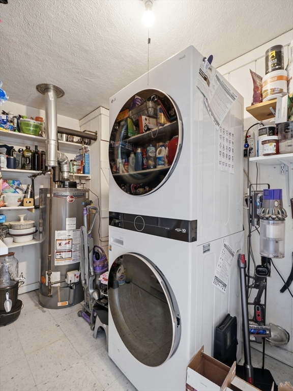 34 Beaconsfield Street Lawrence, MA 01843 - Photo 16 of 29 a utility room with sink dryer and washer
